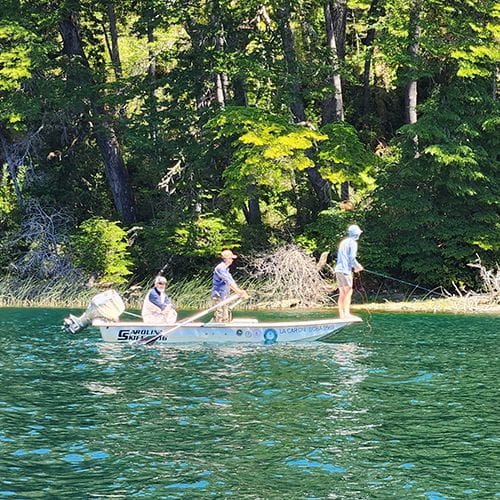 "Best fly fishing guide service offering half and full-day trips in Bariloche, Patagonia, Argentina. Anglers targeting large brown trout on Roca Lake. "