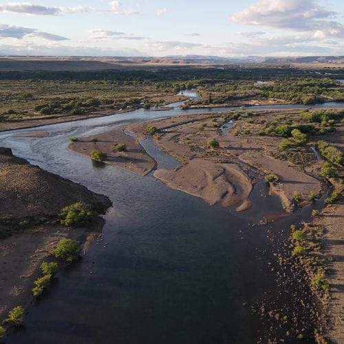 "Top fly fishing guided service in Bariloche, Patagonia, Argentina. Drone view of the scenic Collón Curá River, ideal for multi-day fly fishing trips. "
